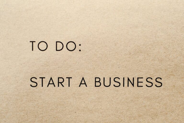 A close-up shot of a to-do list with 'Start a Business' written on it.